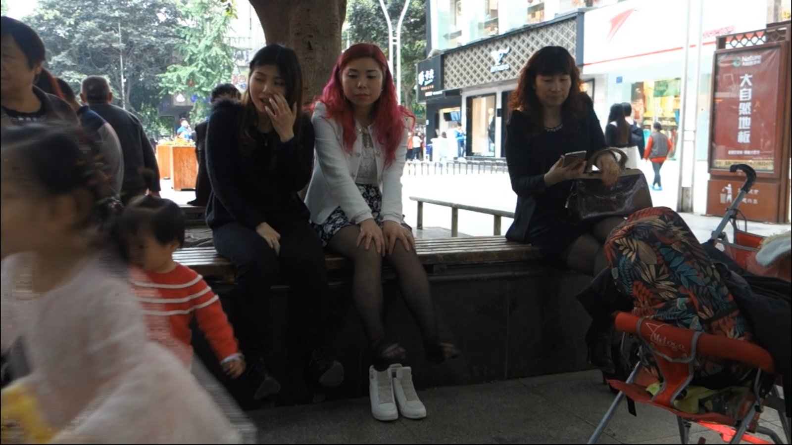 Woman with Black Nylon Stocking Taking off Her Shoes.